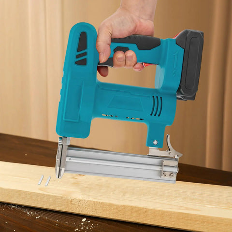 Top Shelf 20V Cordless Brad Nailer Kit With 15Ah Battery Charger, holding brad nail gun above wood board.