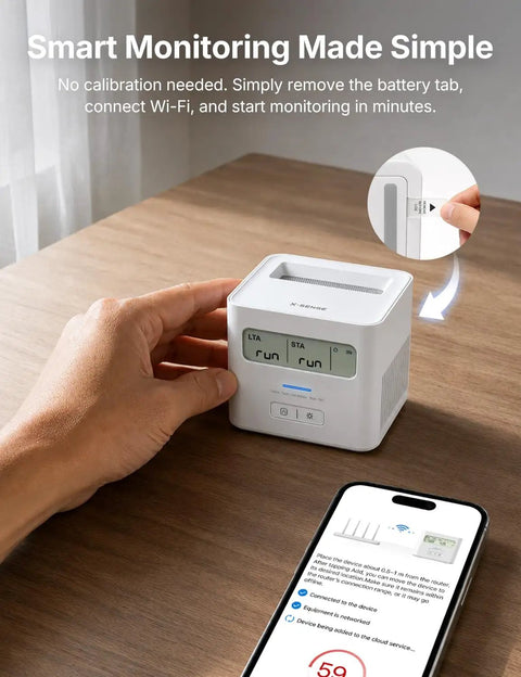 Smart WiFi Radon Detector For Home With Instant App Alerts And Continuous Daily Trend Tracking To Keep Indoor Air Crisp And Your Place Hella Safe All Year Long on wooden desk with smartphone.