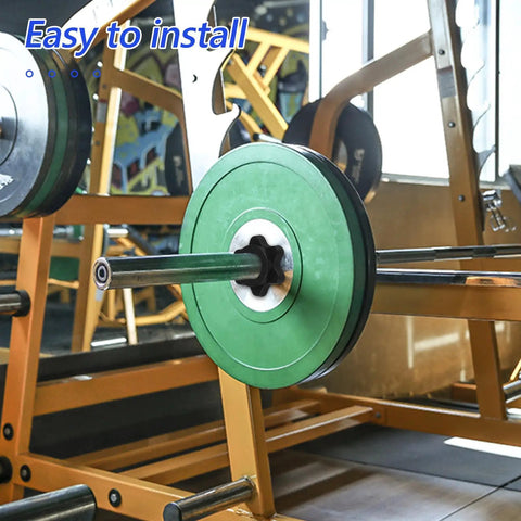 Barbell with green weights secured by self locking barbell collars set of 4 with anti skid plastic six sided nuts in a gym setting