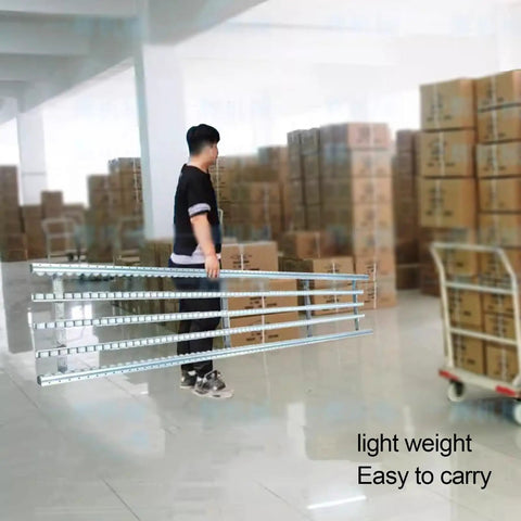 Light Duty Gravity Roller Conveyor With Durable Abs Rollers And Rust Resistant Steel Frame For Smooth Water Carton Transport In Warehouses Factories Or Your Own DIY Projects carried by a person in a warehouse.