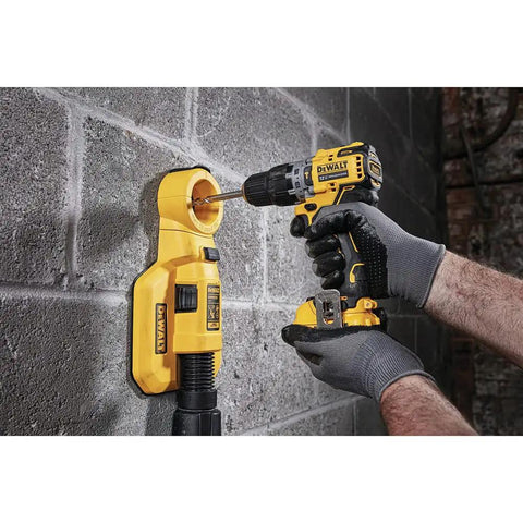 Person using Xtreme 12V Drill Driver Kit with Three Eighths Inch Chuck to drill into concrete wall, showcasing easy bit change.