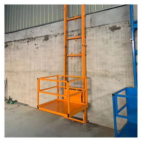 High Capacity Electric Lift Table Glides Smooth As Butter, Crushes Over Four Hundred Kilograms Like A Champ. Orange cargo lift for warehouses.