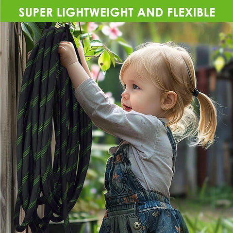Garden hose, black with green stripes, front view, coiled and hung on outdoor wall