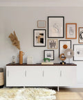 Modern room with art wall, white sideboard, and decor