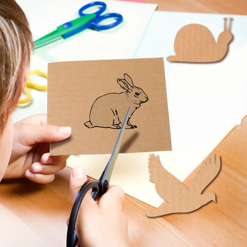 Child cutting a rabbit design from High Grade Corrugated Cardboard Sheets 50 Pack Brown 3mm Thickness 4 X 6 Inches.