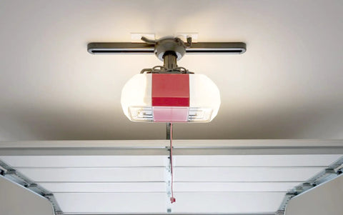 Rough Service 100W LED Light Bulb for Garage, Shop, and Ceiling Fans, installed in a garage ceiling fixture, instant brightness