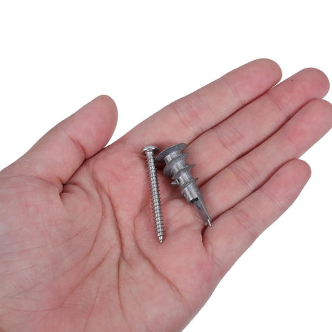 Heavy Duty Drywall Anchors And Self Drilling Screws Kit With Reinforced Support That Keeps Sheetrock From Cracking For Home Renovation And Shelf Mounting Includes 30 Zinc Anchor Sets For Fast Solid Installations. Zinc drywall anchor and screw set in hand