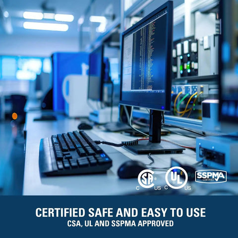 Computer workstation in a lab setting with safety certifications displayed on the monitor.