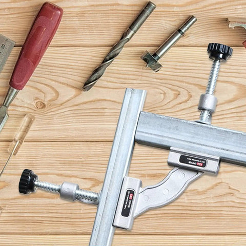 Solid As A Rock Stainless Steel Tube Clamp Heavy Duty Precision Positioning Jig For Welding And Fabrication Built Tough To Lock Your Pieces Down Securely Every Time on wooden surface with tools.