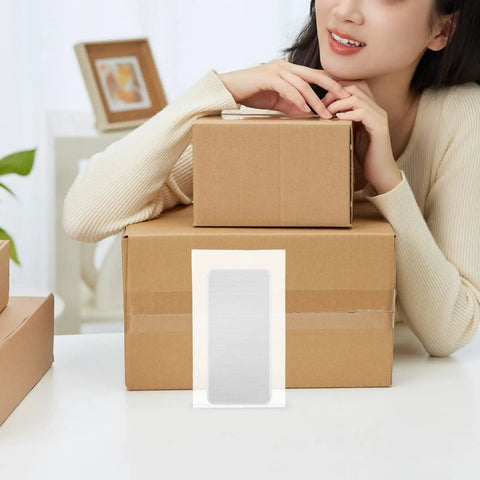 EPE Foam Packing Bags Set 100 Pcs White Thickened Protective Foam Bags For Shipping Fragile Items next to cardboard boxes