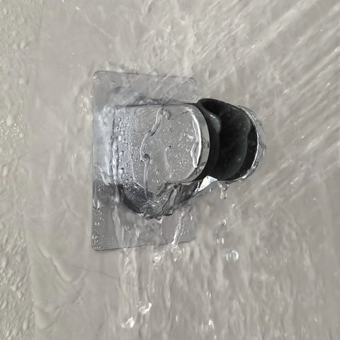 Heavy Duty Shower Head Holder With Tough As Nails Adhesive in use, water flowing over waterproof chrome finish on wall mount bracket