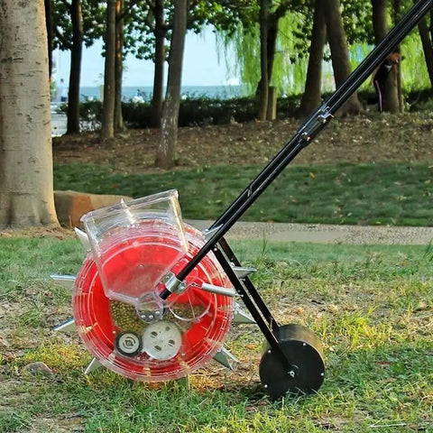 Metal Precision Garden Push Seeder for Walk Behind Row Crop Planting With Clear Seed Storage Box in outdoor setting