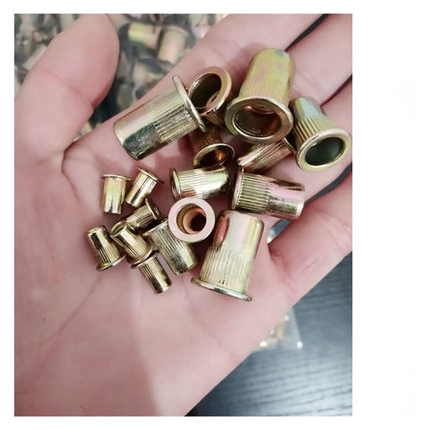 15 Piece Flat Head Rivet Nuts Kit M3 To M12 For Metalworking carbon steel rivet nuts held in a hand, showing quality and flush mount design.