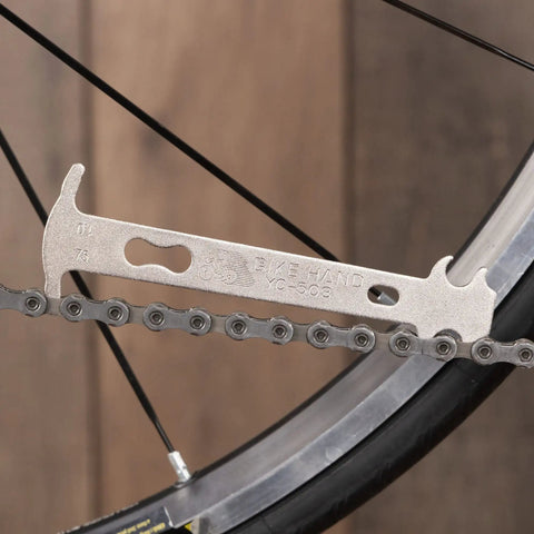 Chain Wear Checker Tool For 7 To 12 Speed Chains, Quick Indicator Of 0.75 Percent Or 1 Percent Stretch attached to bike chain