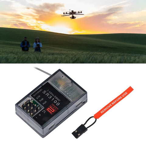 SR3100 2.4GHz DSM2 Receiver for DX Series Drones, with landscape background of flying drone at sunset