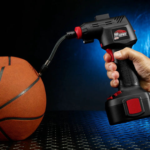 Cordless Tire Inflator With Digital Gauge And LED Light inflating a basketball, showcasing quick connect nozzle and flexible hose