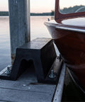 Rugged Rubber Bolt Down Dock Protection For Marinas and Piers Keeps Your Boats Safe From Impacts With Easy Secure Install No Fuss, Shock Absorbing Dock Bumper For Waterfront Use installed on dock with boat