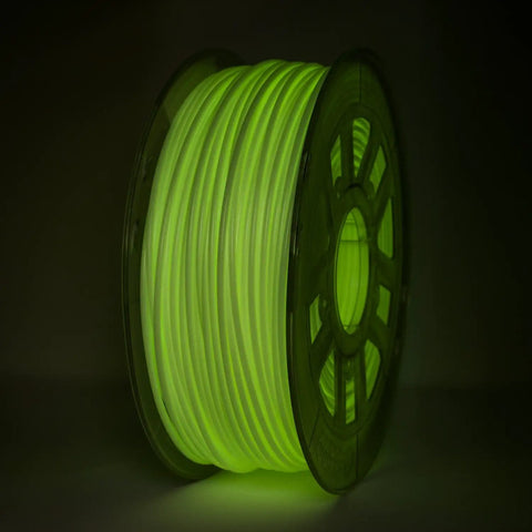 Glow In The Dark Green Hips Filament For 3D Printers 1Kg Spool 285Mm lit up in a dark setting, showcasing its vibrant green hue.