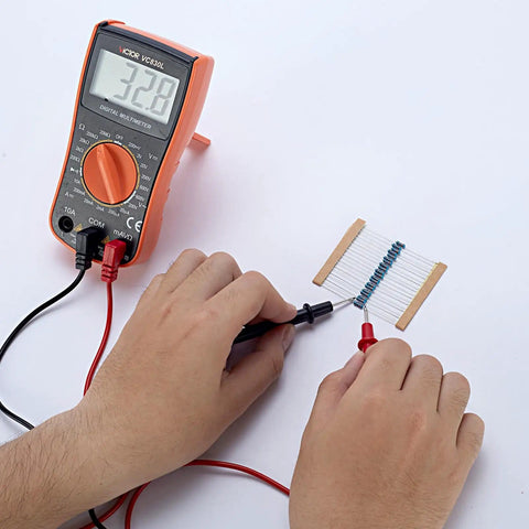 Testing resistors from Massive 1000 Pack Metal Film Resistor Kit With 50 Values 0.25W 1% Tolerance using a multimeter.