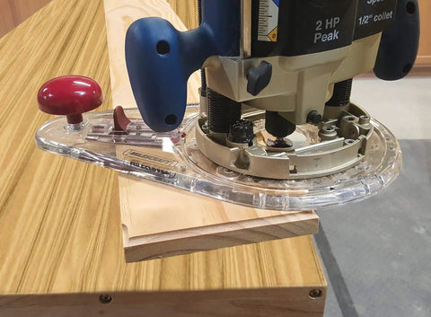 Adjustable Circle Cutting Guide Set Featuring Built Tough Metric And Imperial Scales For No Sweat Precision Cutting With Top Shelf Inside Outside Router Templates For Custom Woodworks on a router cutting wood.
