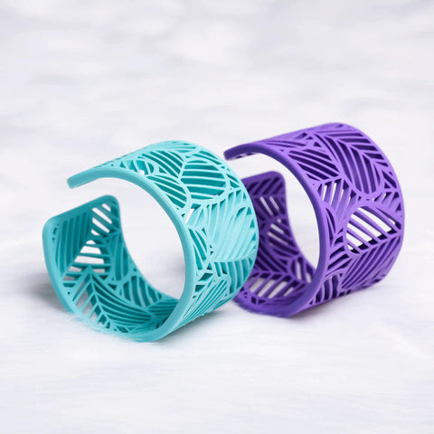 Heavy Hitter PLA Filament For 3D Printers 1.75mm 0.75kg Red Spool displayed in teal and purple bracelet designs.
