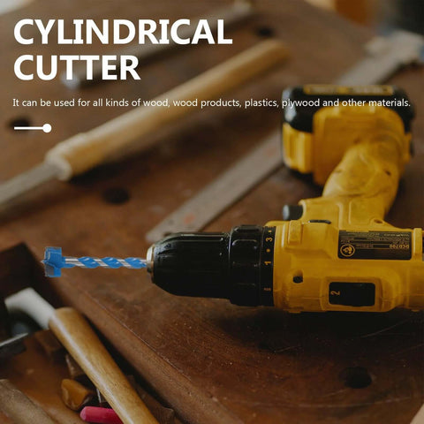 Front-side view of a yellow cordless drill with a blue twist drill bit in the chuck for woodworking.