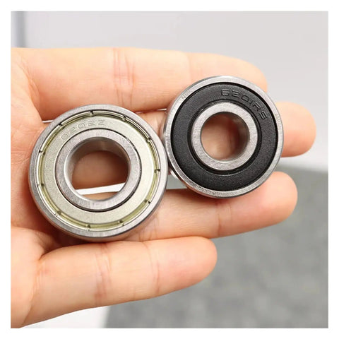 Heavy Duty Deep Groove Ball Bearing Set Sizes 6200 Through 6207 featuring ZZ DDU RS seals held in hand for electric motorcycles.