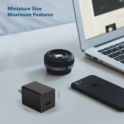 Hidden USB Charger Spy Camera With WiFi Live View 1080p HD Recording For Home Security And Baby Monitor next to phone and lens