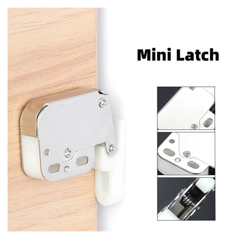 Cool Push To Open Touch Latches Make Handleless Cupboards A Breeze Secure Your Kitchen Or Closets Quickly With These Amazing Spring Catch Door Holders No Drilling Needed Super Easy Install For Fast Setup And Reliable Closures That Keep Everything Locked. Mini latch shown on wooden surface, featuring a sleek silver finish and white plastic detail.