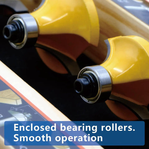 Close-up of carbide router bit set twenty four piece with one quarter inch shank showing enclosed bearing rollers.