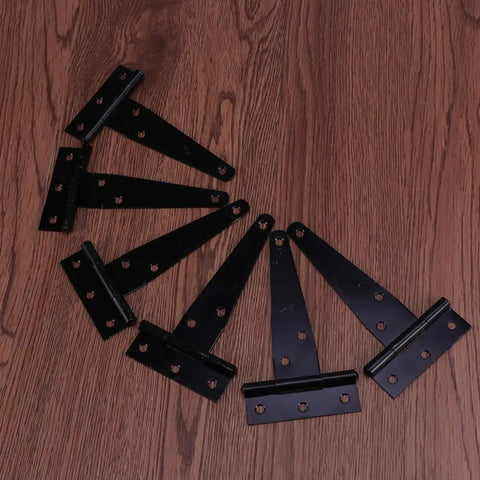 Heavy Duty Iron Black T Shape Door Hinges Set 24 Pieces 4 Inch Gate Hinges With Six Screw Holes displayed on wooden surface