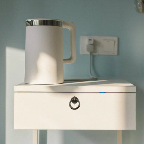 White cabinet with Vintage Cabinet Handles And Antique Drawer Pulls Set With Retro Alloy Door Knobs, next to an electric kettle.
