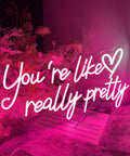 Lit Like Really Pretty Neon Sign LED Neon Lights for Bedroom Decor with pink LED text and heart symbol on a soft backdrop