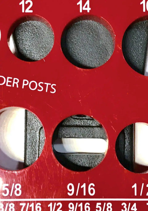 Close-up of red measurement board showing 9/16 inch slot for Gray Long Pedal Straps For Stationary Bikes Replacement Universal 2 Inch Wide 12 and a Half Inch Long Easy Install For Exercise Bike Home Gym Fits Most Pedals For Everyday Use.