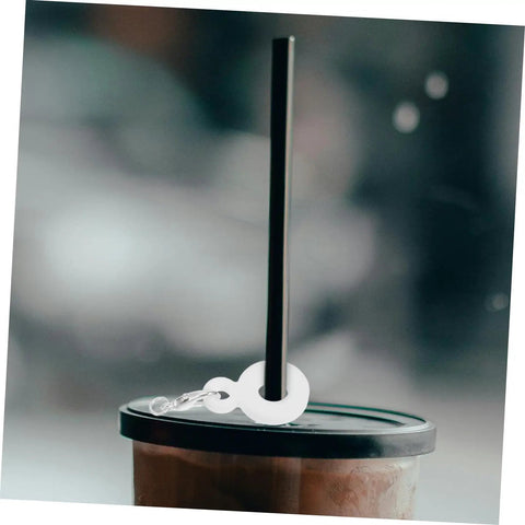 Black tumbler with lid and straw featuring Six Piece Set Straw Charms For Tumblers And Cups Cute Dangle Toppers That Are Easy To Attach