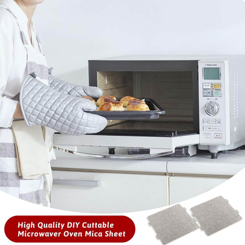 Person wearing oven mitts using microwave with Six Pack Microwave Waveguide Covers Mica Sheets For Oven Protection Prevent Moisture And Grease Splash Shield Magnetron Extend Oven Life Replacement Parts For Home Kitchen Office Or Restaurant Use visible nearby.