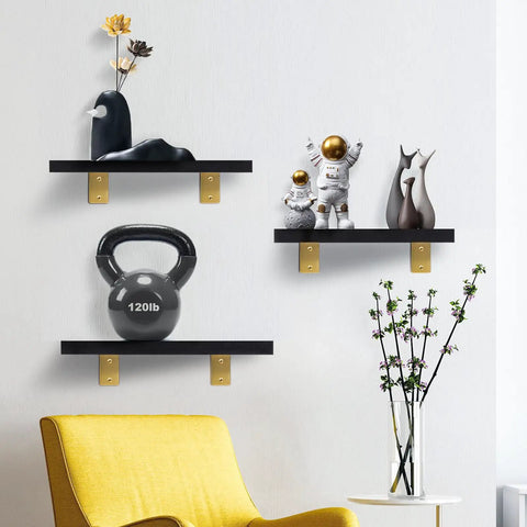 Slick Gold Finish Stainless Steel L Brackets Four Pack Zero Fuss Rock Solid Gear Floating Shelf Wall Supports Built Tough Heavy Duty Hardware For Modern Diy Projects showcasing black shelves with gold brackets.