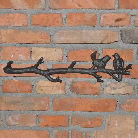 Vintage Cast Iron Tree Branch Coat Hook For Walls And Entryways Bringing Dope Rustic Vibes And Straightforward Storage Solutions That Honestly Upgrade Your Home Decor Setup on brick wall