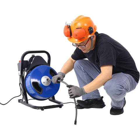 Heavy Duty Electric Drain Snake With Sixty Foot Flex Cable And Foot Switch That Busts Stubborn Clogs Like Nobody Business Featuring One Third HP Motor and Four Swappable Cutters For No Nonsense Plumbing Work in use with flexible cable.
