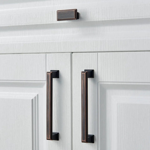 Built Tough Rectangular Cabinet Knobs Ten Pack Oil Rubbed Bronze Finish Heavy Duty Solid Metal Drawer Pulls For Kitchen Cabinets and Custom Storage Shelves on white cabinetry.