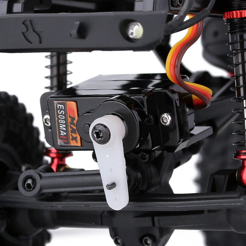 Close-up of Two Pack Emax ES08MAII 12g Analog RC Servo attached to RC crawler, showcasing metal gear and wires, part of upgrade parts.