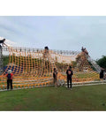 People climbing on a structure with a Beefy Heavy Duty Polyester Lifting Net For Cargo, Garden And Industrial Tasks stretched over it.