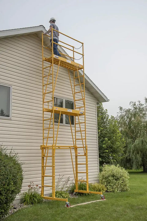 Heavy Duty Adjustable Work Platform Featuring Locked Safety Rails, 11 foot height, used outdoors against a house for repairs.