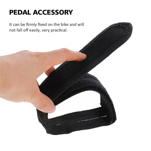 Close-up of 1 Pair Kids Bike Toe Clips And Pedal Straps Set Adjustable Footrests Anti Slip Straps Nylon Black being held by hand.