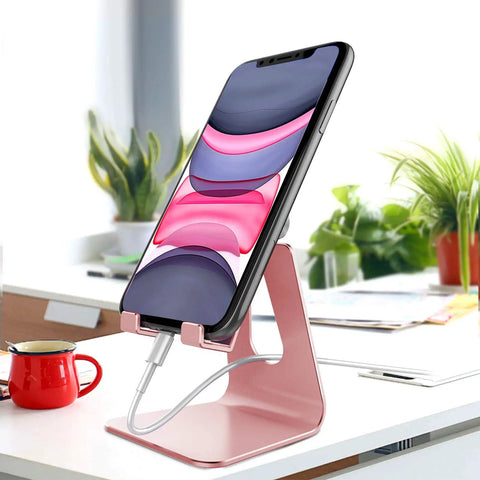 Rose Gold Adjustable Aluminum Phone Stand For All Phones With 270 Degree Tilt Case Friendly Clamp holding smartphone on desk