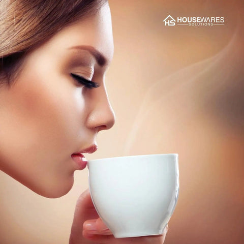 Woman enjoying a hot beverage, promoting 24 Pack Charcoal Water Filter Replacements For Keurig Coffee Makers 2 Point 0