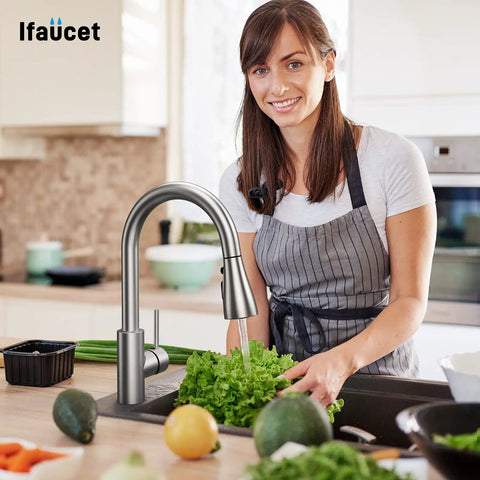 Woman using Pull Down Sprayer Head with Three Modes and 17 Adapters for Kitchen Faucets, rinsing lettuce at sink