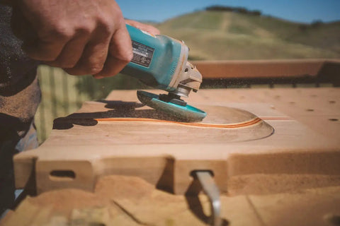Shaping Dish Wood Carving Wheel for Angle Grinder Fine Grade, 4-1/2 In Dia, in use on wooden surface for smooth cuts