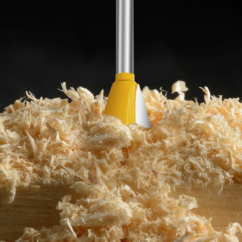 Hella Durable Six Piece Dovetail Router Bit Set Quarter Inch Shank, yellow cutter head above wood shavings.