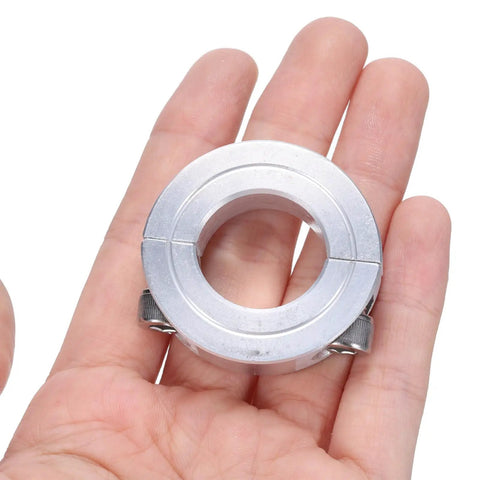 Double Split Shaft Collar Clamp For Seven Eighths Inch Shaft held in hand, aluminum alloy, two piece clamping design.
